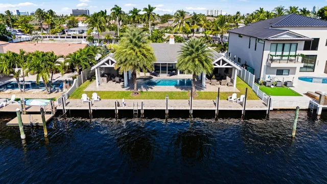 a view of a house with pool and a table