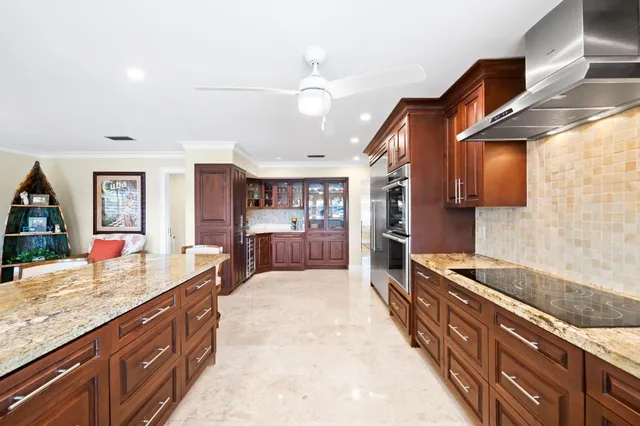 a very nice looking room with a large window and chandelier
