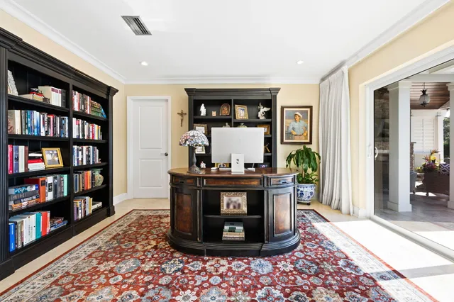 a dining room with furniture a chandelier and wooden floor
