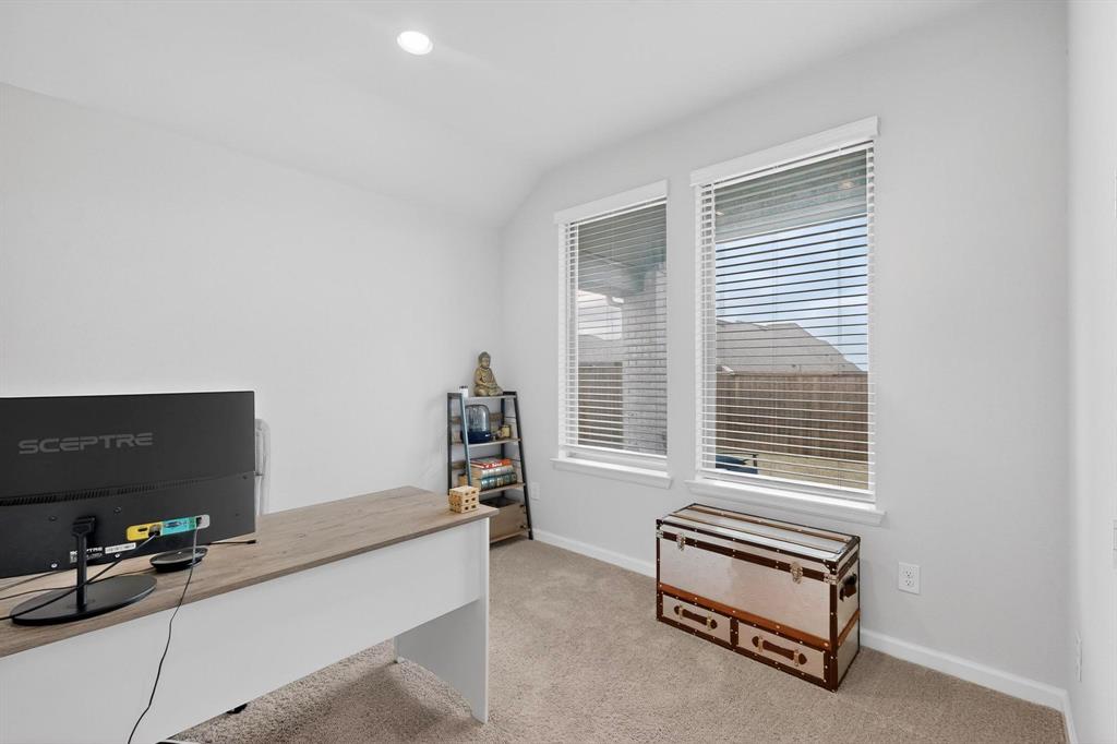 2319 Kirkstall Way Forney, TX 75126 - Photo 22 of 29 a living room with furniture a flat screen tv and a window