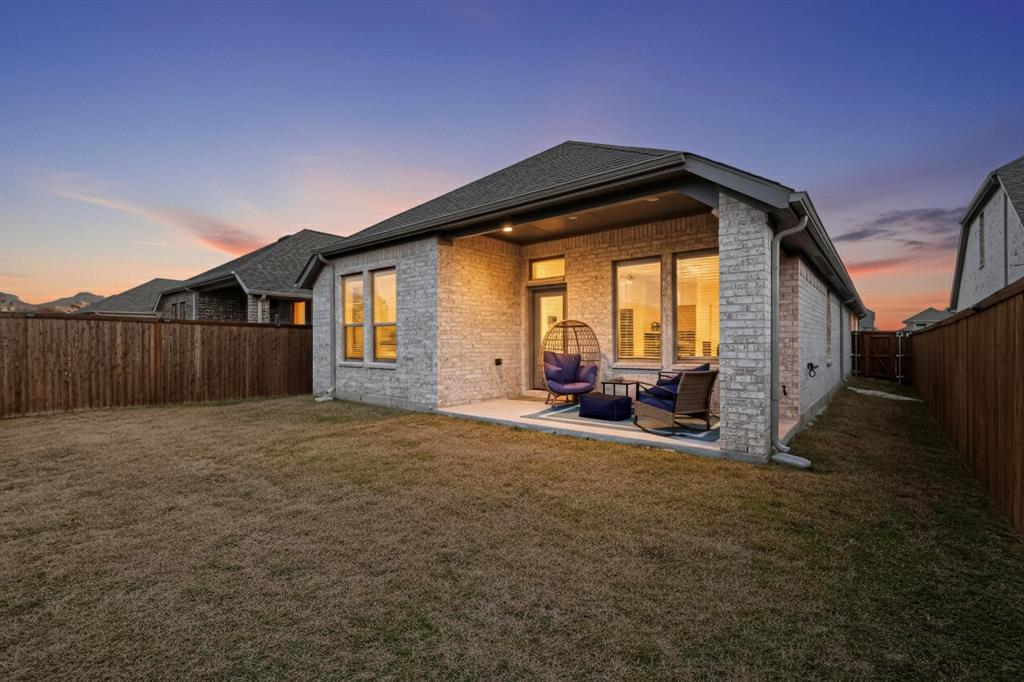 2319 Kirkstall Way Forney, TX 75126 - Photo 28 of 29 a view of a house with backyard and roof