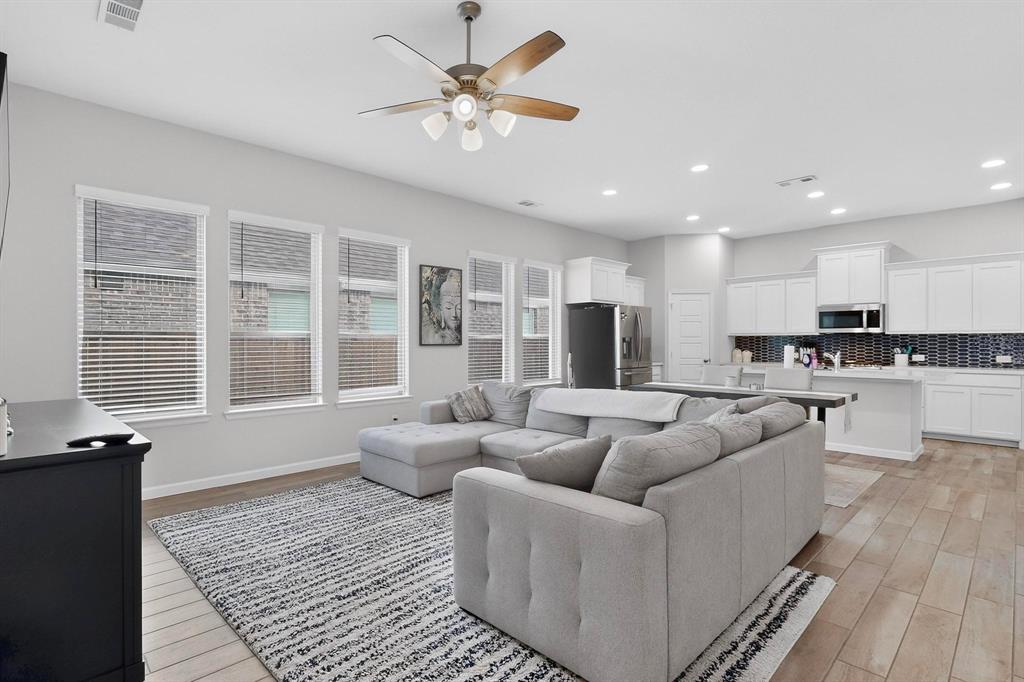 2319 Kirkstall Way Forney, TX 75126 - Photo 8 of 29 a living room with furniture and a large window