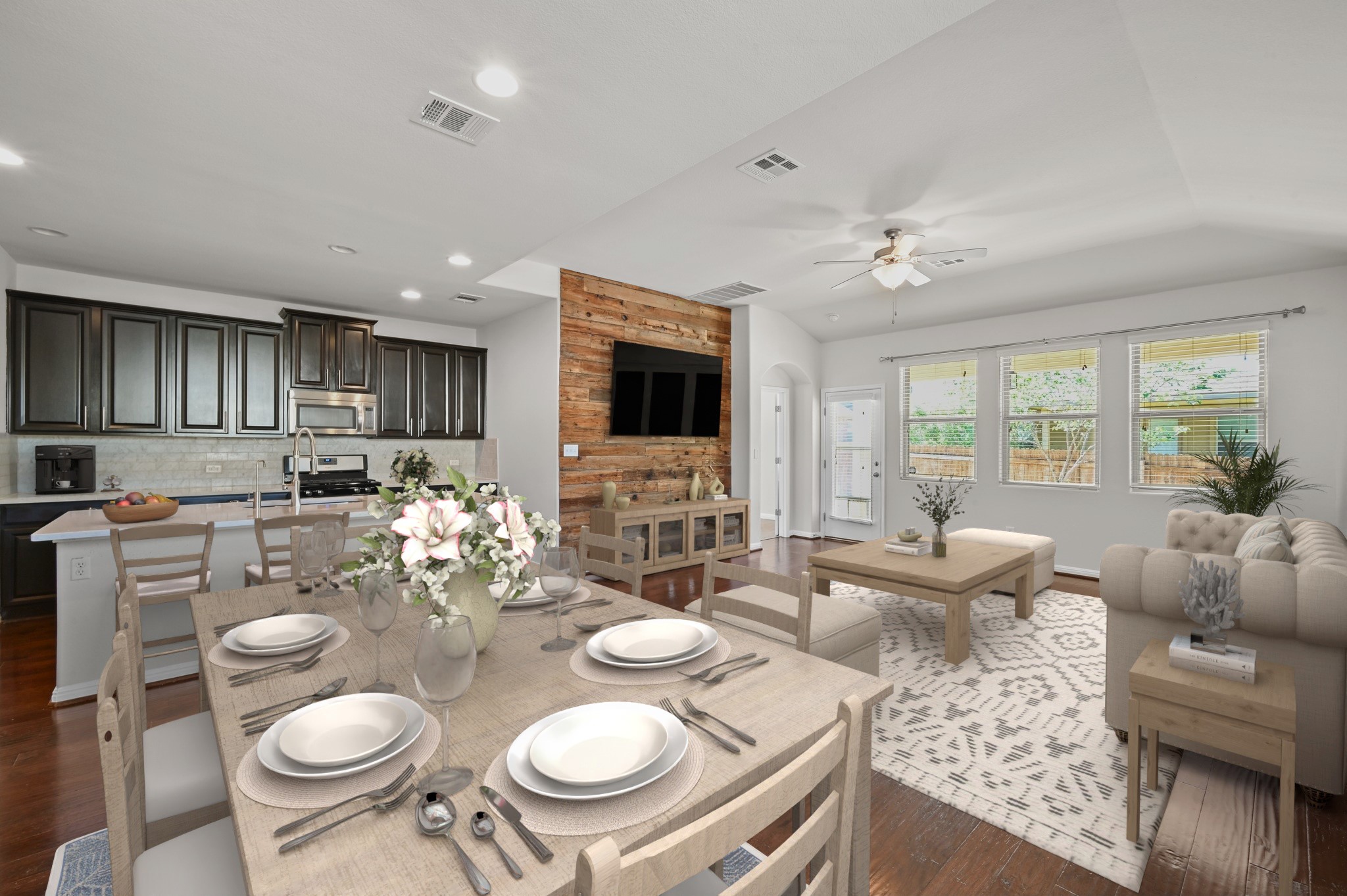 351 Wincliff Drive Buda, TX 78610 - Photo 7 of 40 An inviting open-concept layout unites kitchen, dining, and living spaces for effortless entertaining.