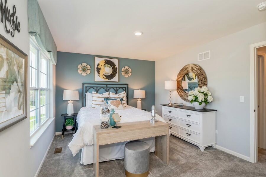 11290 Green Place Winfield, IN 46307 - Photo 21 of 27 a living room with furniture and a clock