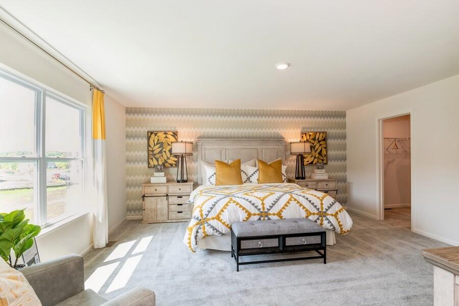 11290 Green Place Winfield, IN 46307 - Photo 23 of 27 a bed sitting in a bedroom next to a window