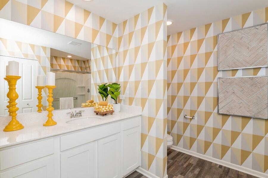 11290 Green Place Winfield, IN 46307 - Photo 24 of 27 a bathroom with a sink a mirror and a shower curtain