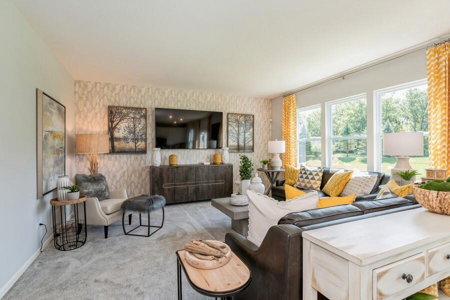 11290 Green Place Winfield, IN 46307 - Photo 4 of 27 a living room with furniture and a flat screen tv