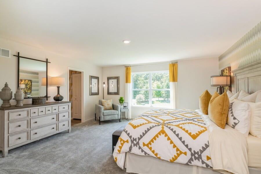 11290 Green Place Winfield, IN 46307 - Photo 8 of 27 a bedroom with a bed and a dresser