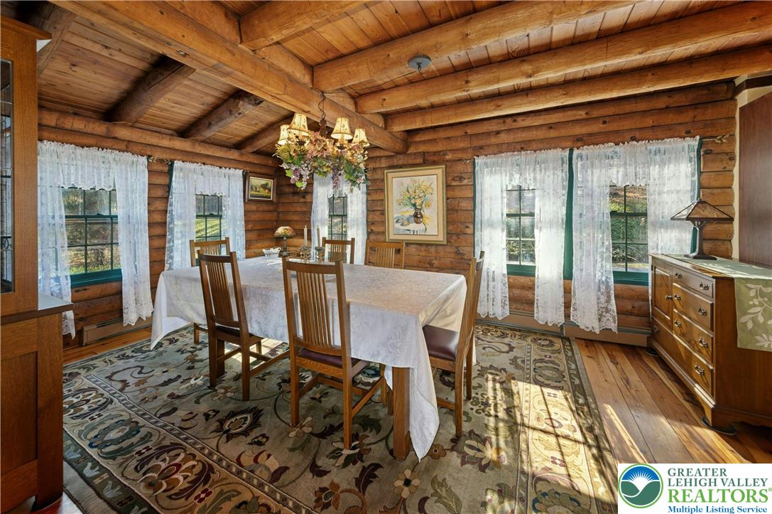 3980 Lehnenberg Road Riegelsville, PA 18077 - Photo 12 of 41 a view of a dining room with furniture wooden floor and a chandelier
