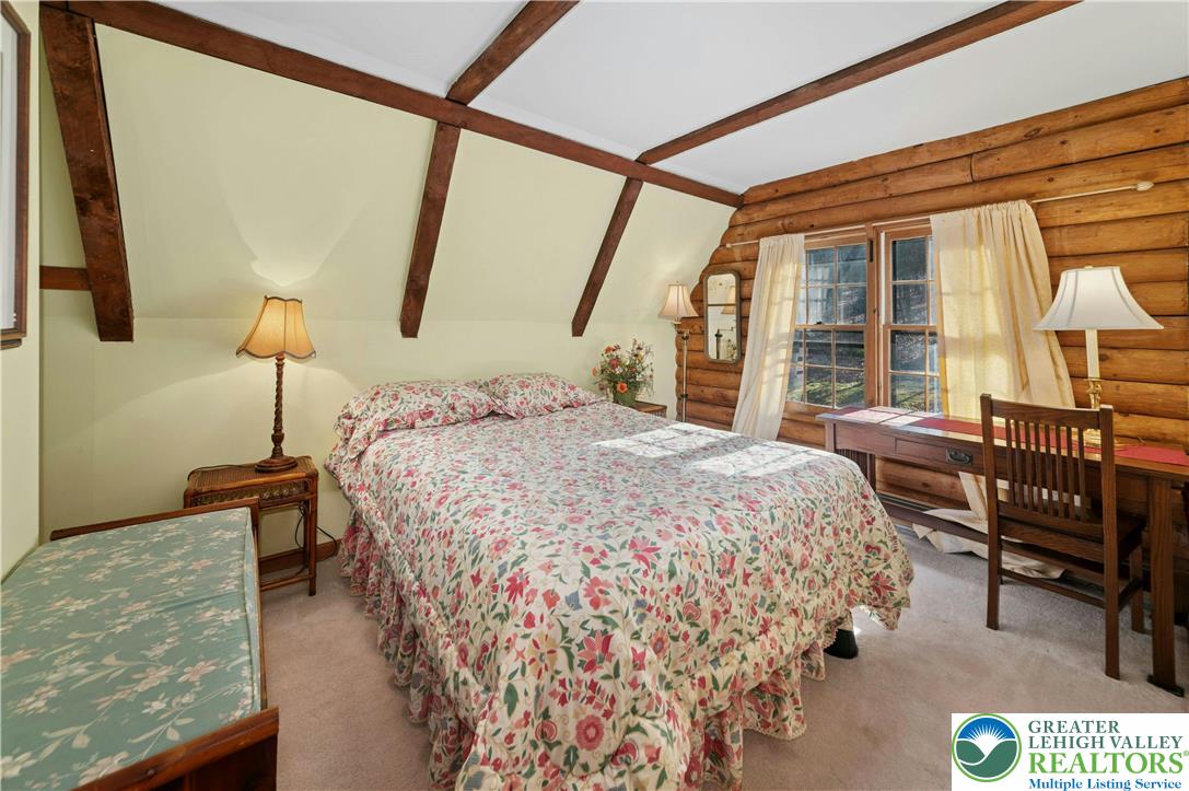 3980 Lehnenberg Road Riegelsville, PA 18077 - Photo 19 of 41 a bed sitting in a bedroom next to a window