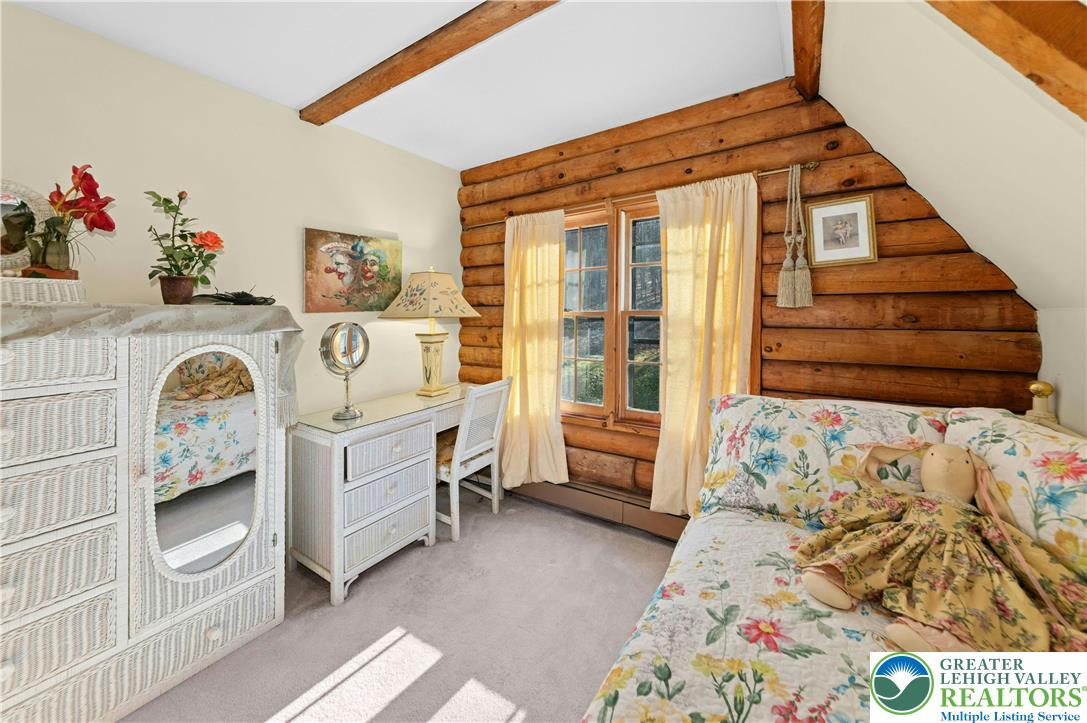 3980 Lehnenberg Road Riegelsville, PA 18077 - Photo 21 of 41 a bedroom with a bed and a window