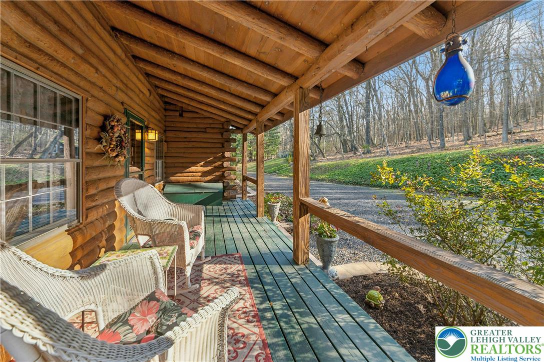 3980 Lehnenberg Road Riegelsville, PA 18077 - Photo 27 of 41 a roof deck with table and chairs and potted plants
