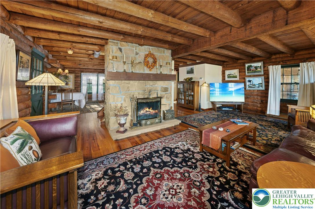 3980 Lehnenberg Road Riegelsville, PA 18077 - Photo 6 of 41 a living room with furniture and a fireplace