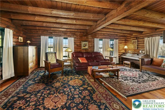 a living room with furniture and a rug