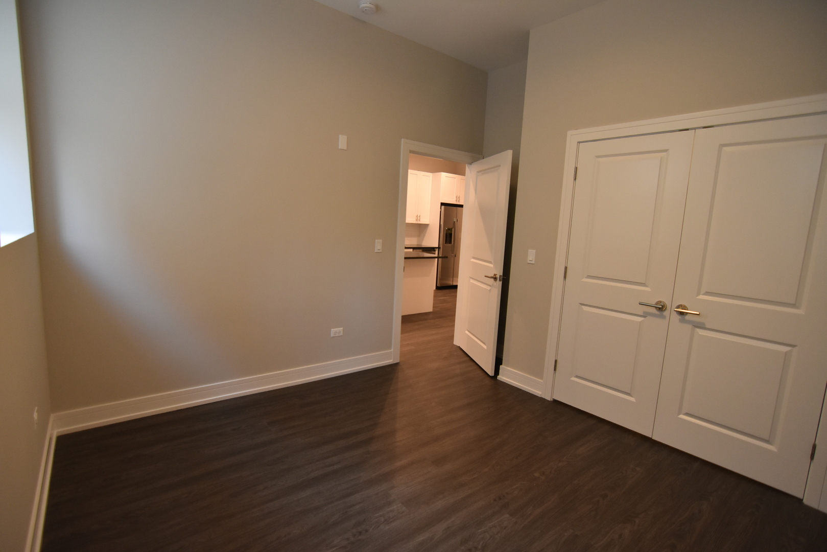 1730 West Greenleaf Avenue, Unit 102 Chicago, IL 60626 - Photo 11 of 15 a view of an empty room with wooden floor