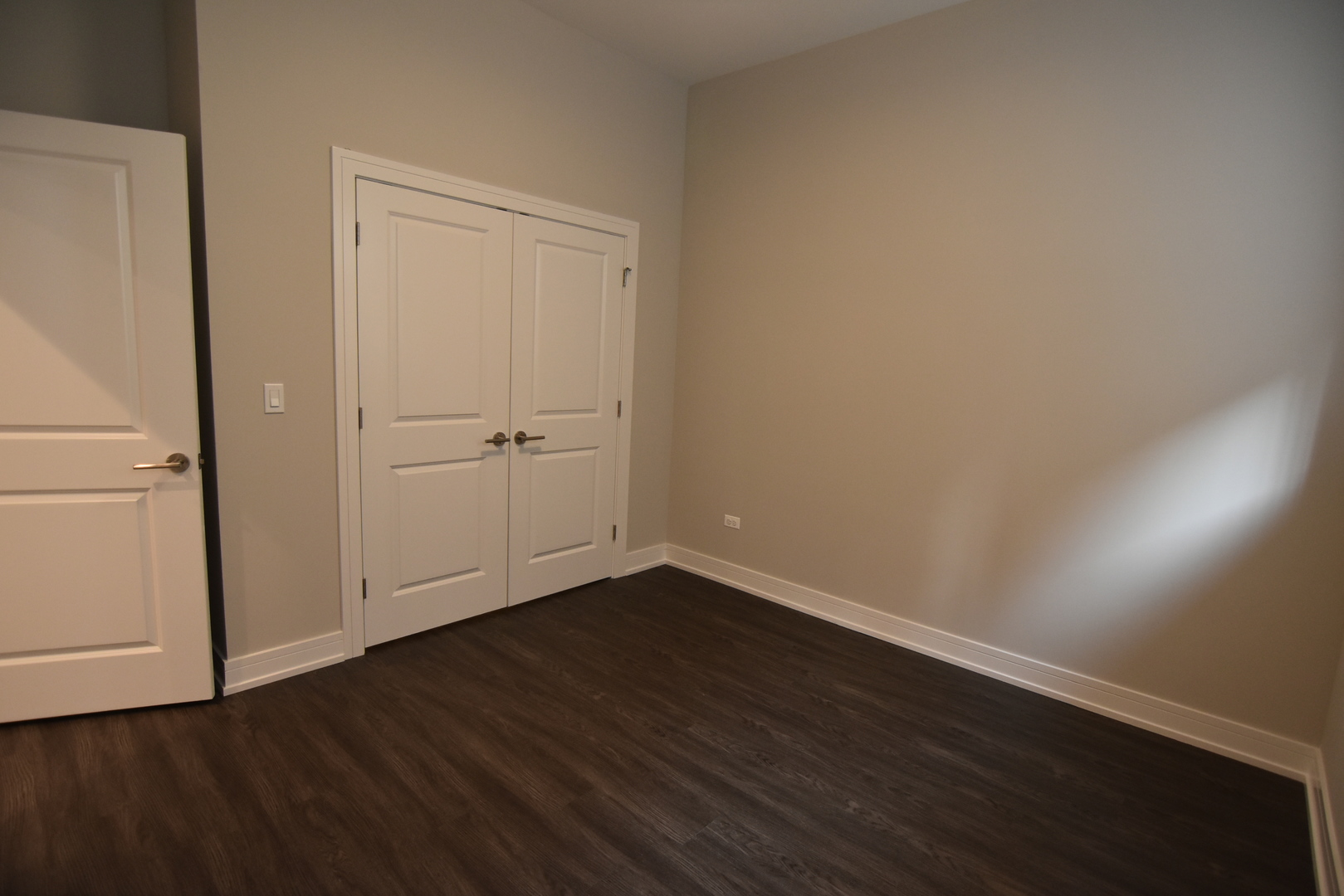 1730 West Greenleaf Avenue, Unit 102 Chicago, IL 60626 - Photo 12 of 15 wooden floor in an empty room
