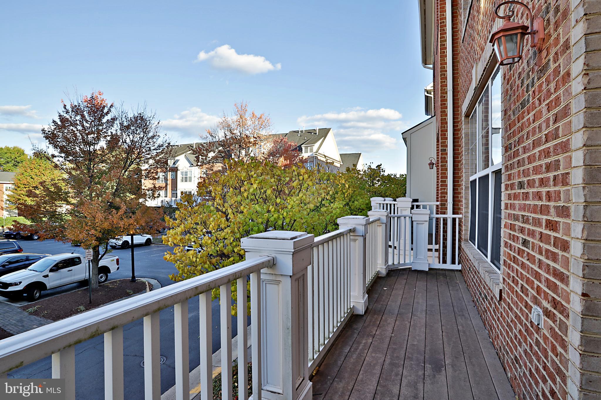 135 Fortnightly Boulevard Herndon, VA 20170 - Photo 14 of 29 a view of a balcony with wooden floor