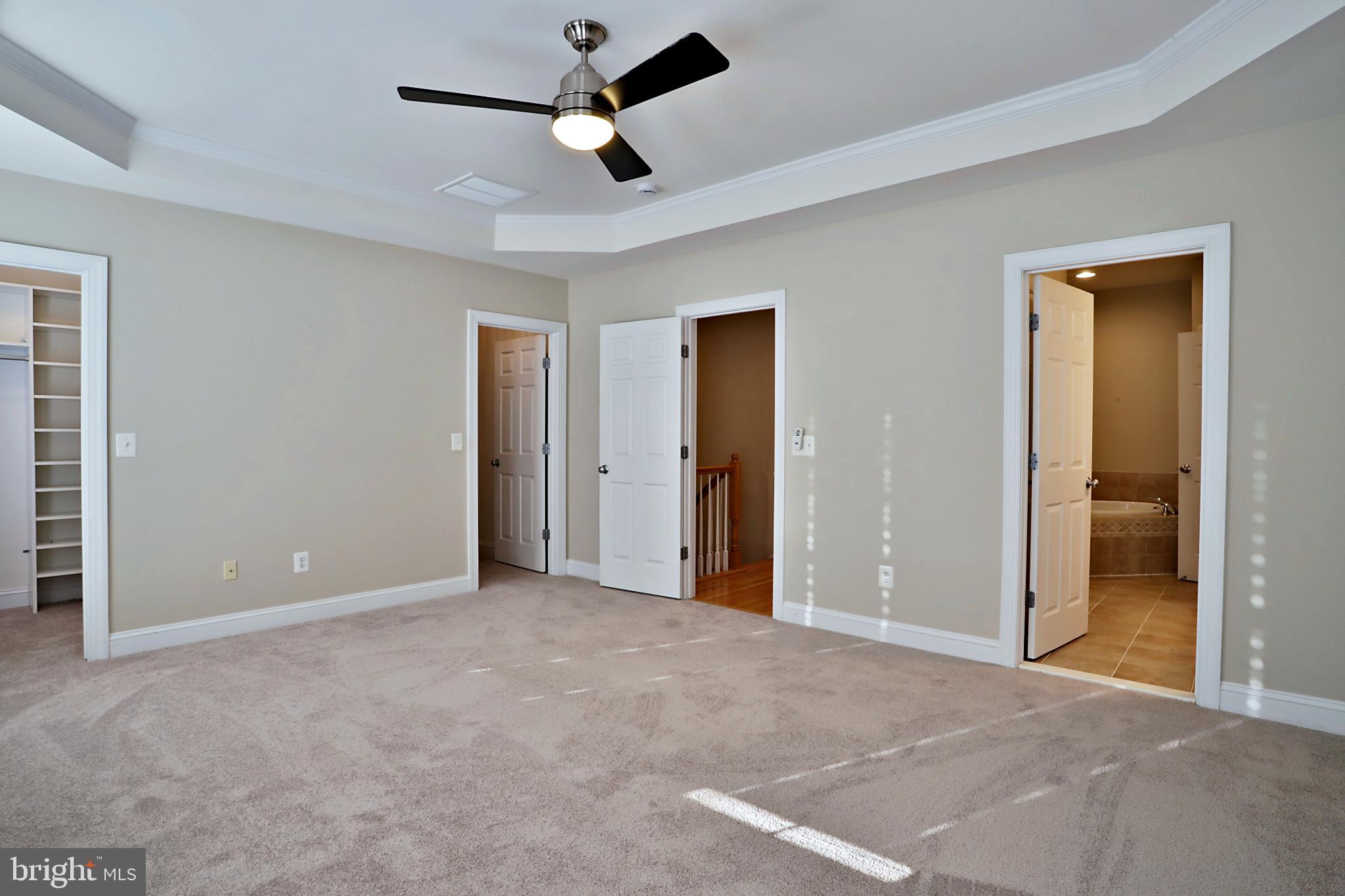 135 Fortnightly Boulevard Herndon, VA 20170 - Photo 21 of 29 an empty room with closet and a ceiling fan