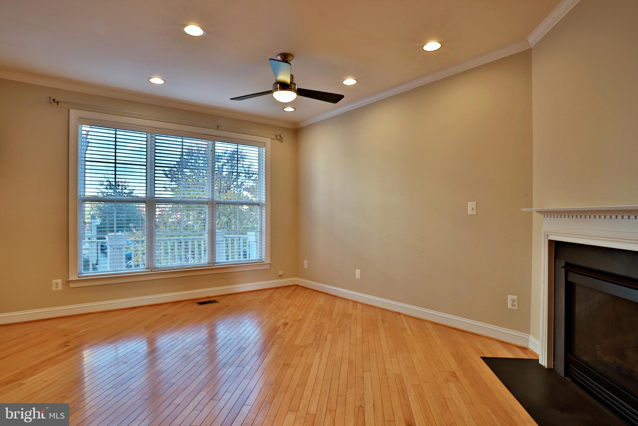 135 Fortnightly Boulevard Herndon, VA 20170 - Photo 8 of 29 a view of an empty room with wooden floor and a window