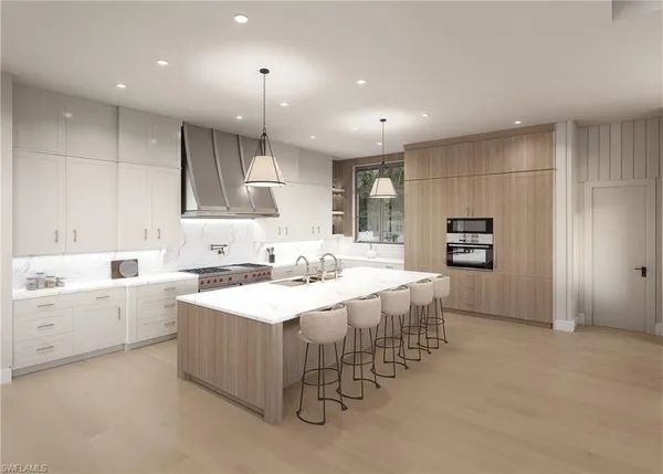 a large kitchen with a lot of counter space and appliances