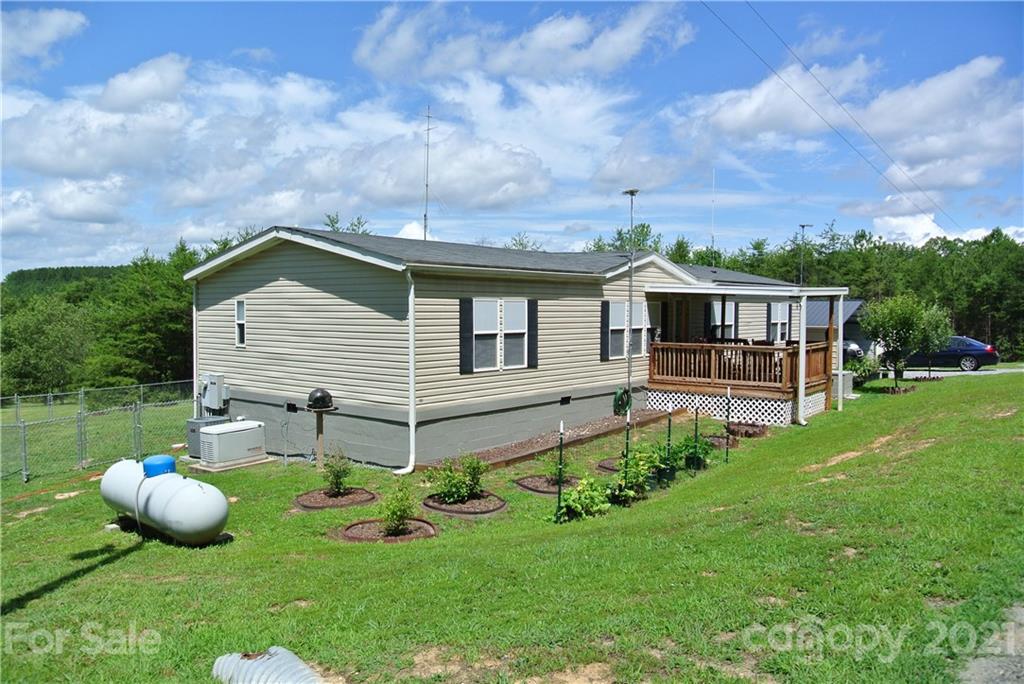475 West V Thompson Road Rutherfordton, NC 28139 - Photo 1 of 46 a view of a house with a backyard and sitting area