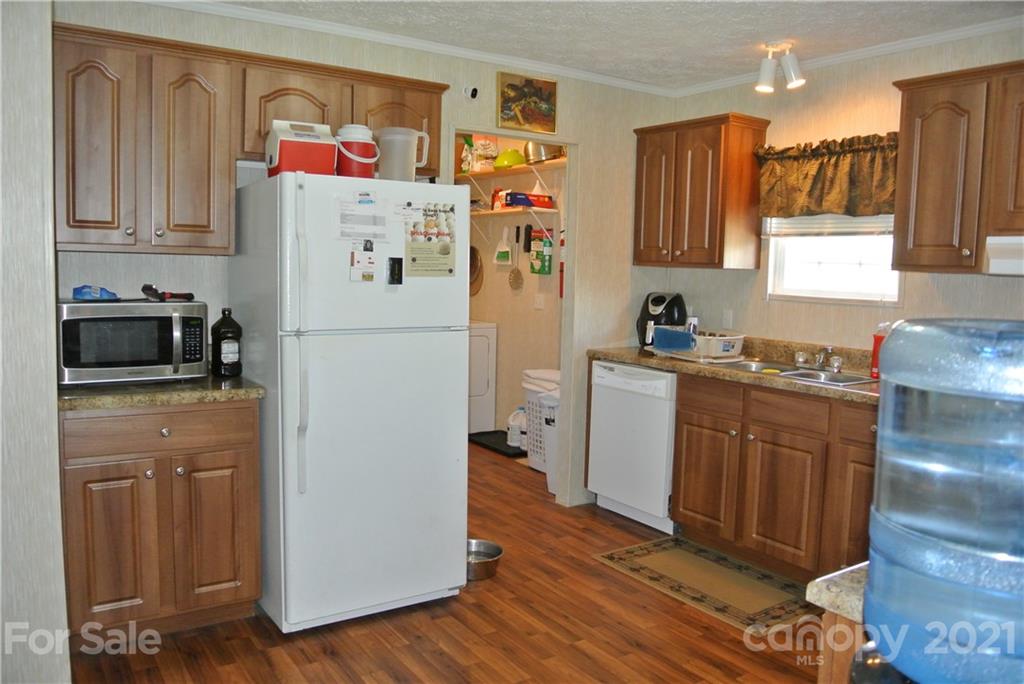 475 West V Thompson Road Rutherfordton, NC 28139 - Photo 11 of 46 a white refrigerator freezer sitting inside of a kitchen
