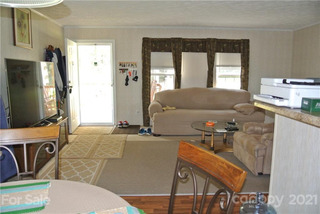 475 West V Thompson Road Rutherfordton, NC 28139 - Photo 14 of 46 a living room with furniture and a flat screen tv
