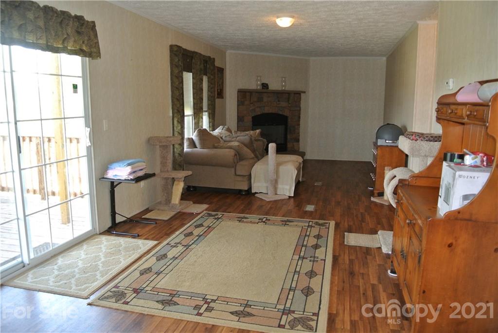 475 West V Thompson Road Rutherfordton, NC 28139 - Photo 15 of 46 a living room with furniture and a fireplace