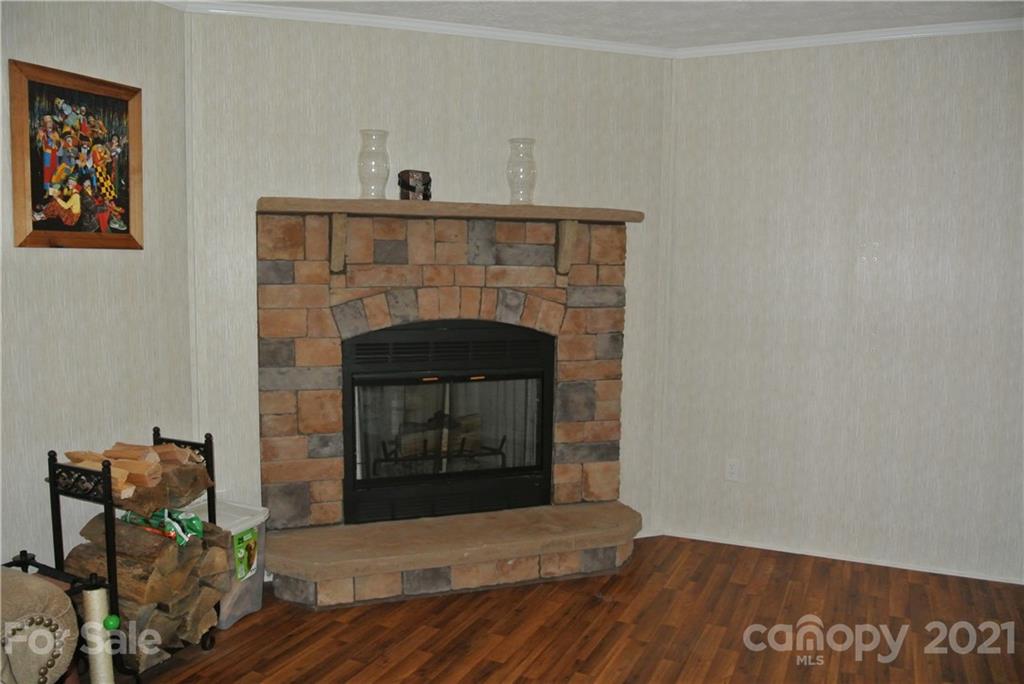475 West V Thompson Road Rutherfordton, NC 28139 - Photo 16 of 46 a living room with furniture and a fireplace