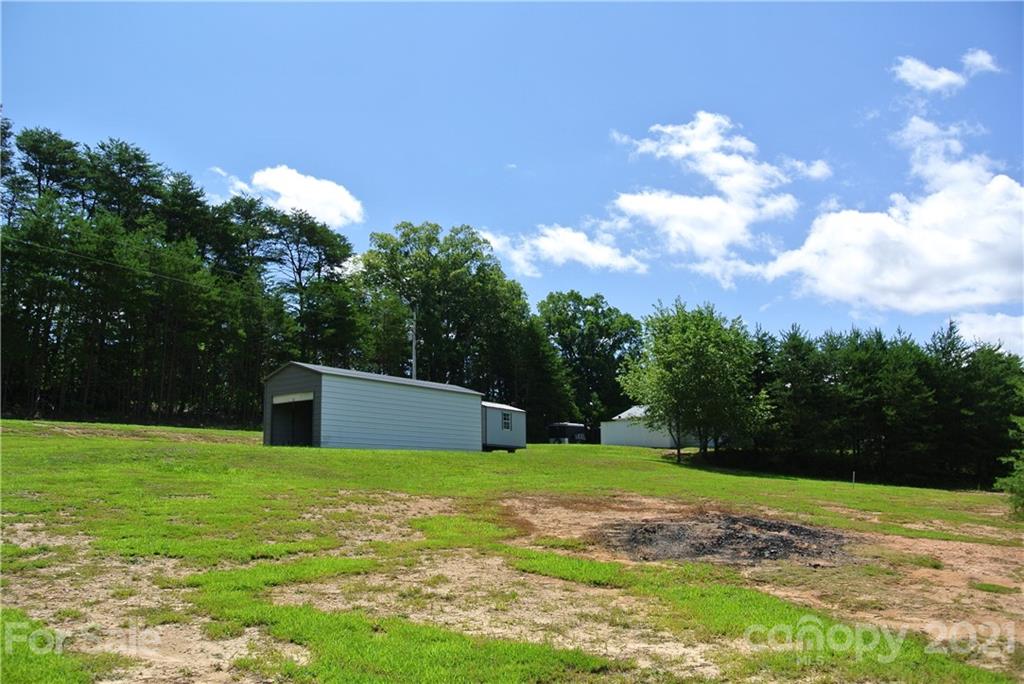 475 West V Thompson Road Rutherfordton, NC 28139 - Photo 31 of 46 a view of a house with a backyard