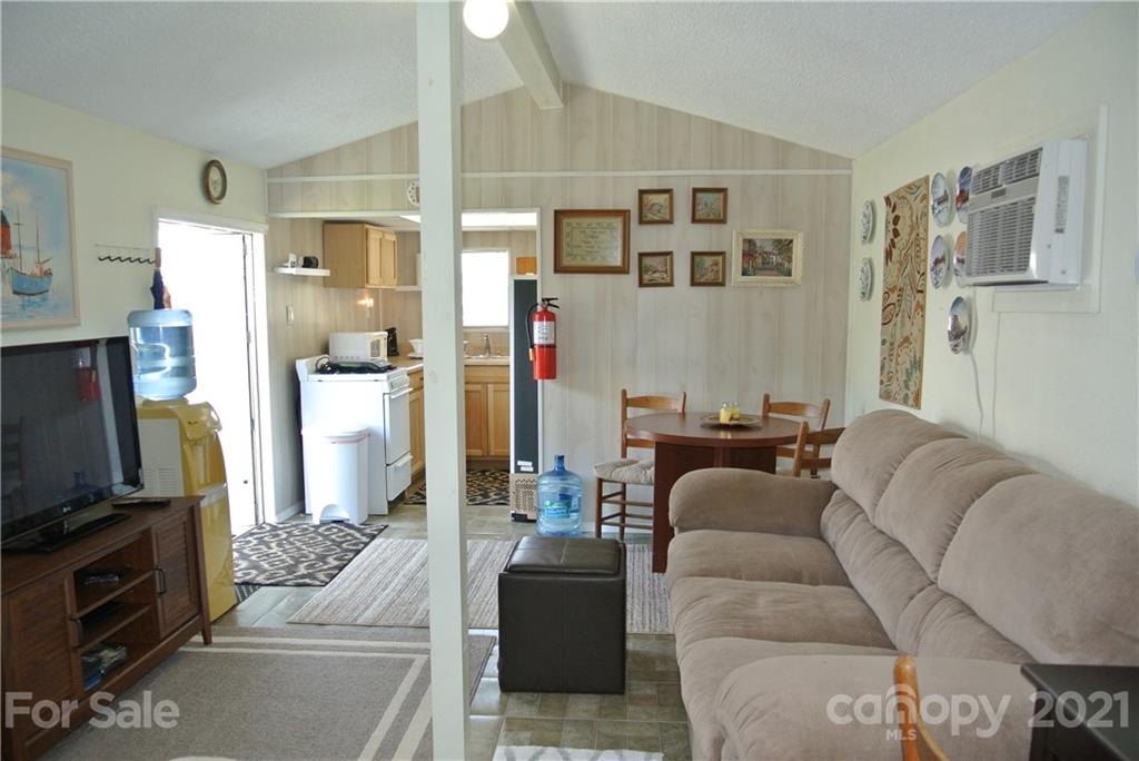 475 West V Thompson Road Rutherfordton, NC 28139 - Photo 39 of 46 a living room with furniture and a flat screen tv