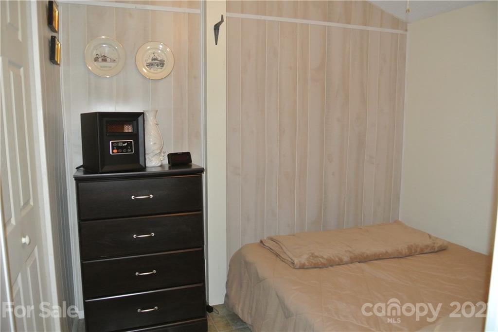 475 West V Thompson Road Rutherfordton, NC 28139 - Photo 43 of 46 a bedroom with a bed and a dresser