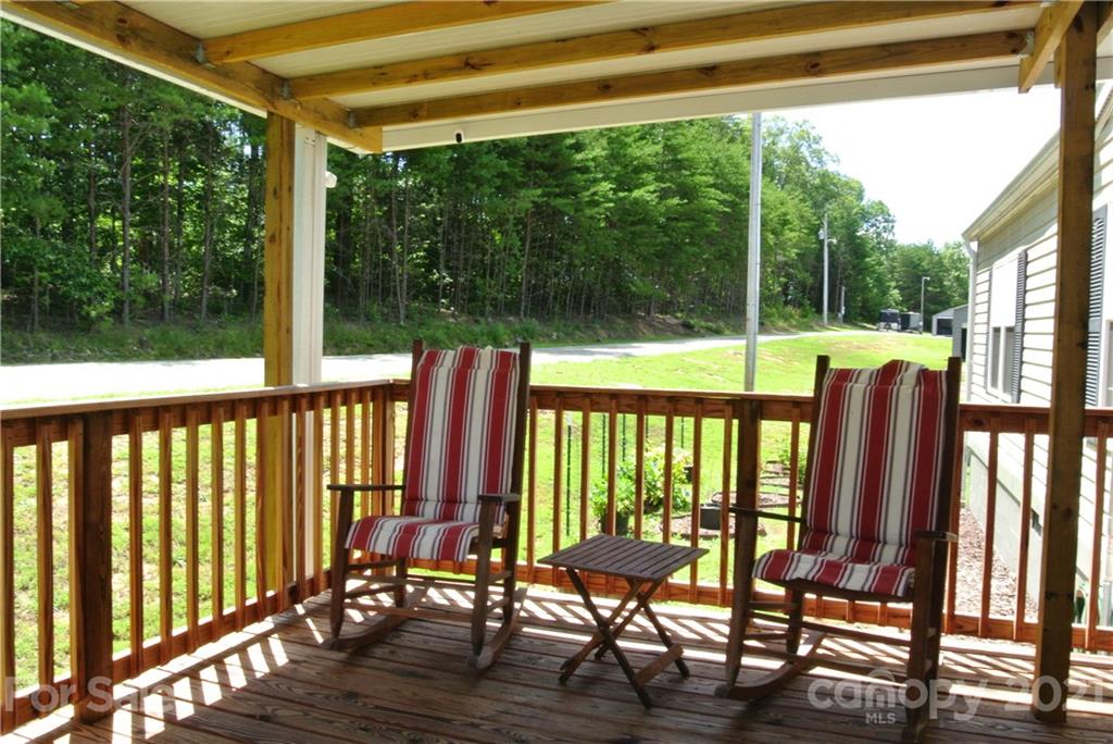 475 West V Thompson Road Rutherfordton, NC 28139 - Photo 6 of 46 a view of a chairs and table in patio with a backyard