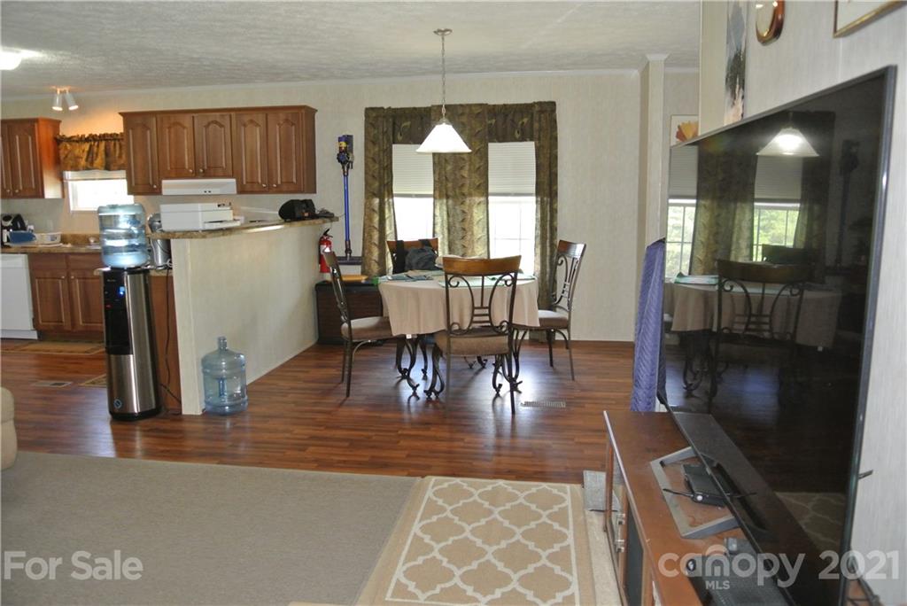 475 West V Thompson Road Rutherfordton, NC 28139 - Photo 7 of 46 a view of a dining room with furniture window and wooden floor