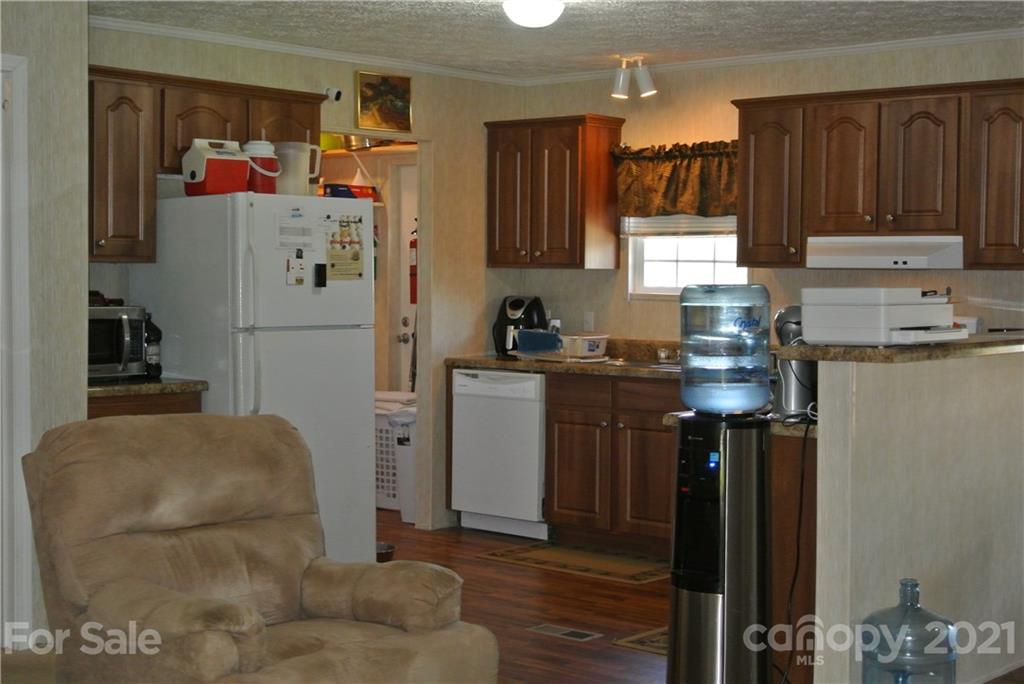 475 West V Thompson Road Rutherfordton, NC 28139 - Photo 9 of 46 a kitchen with a refrigerator and a stove top oven