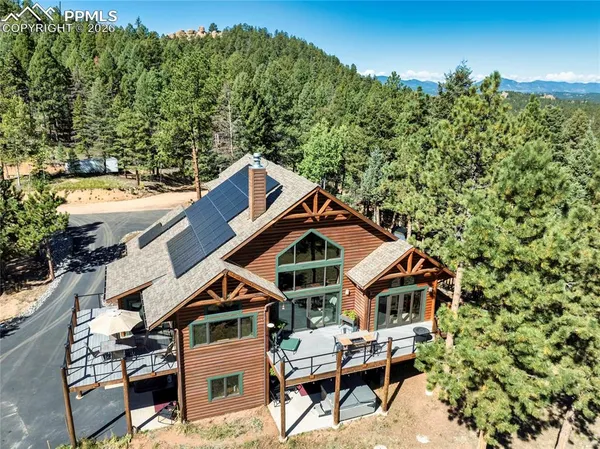 a aerial view of a house with a yard
