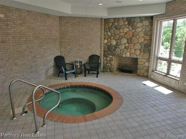 2700 East Coon Lake Road Howell, MI 48843 - Photo 16 of 23 Spa w/fireplace