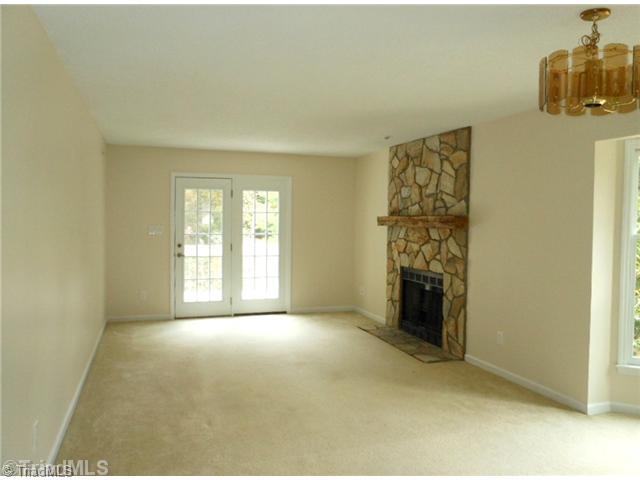 Living Room. There is a large living room and dining room combo. The dining table sits by the bay window and has a lovely view of the side yard. The walls and ceilings have just been painted a neutral color.