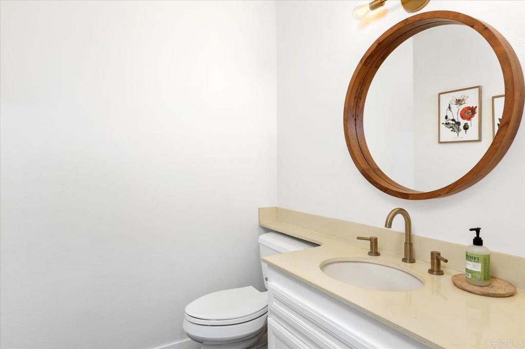 365 Windyridge Glen Escondido, CA 92026 - Photo 11 of 24 a bathroom with a sink and a mirror