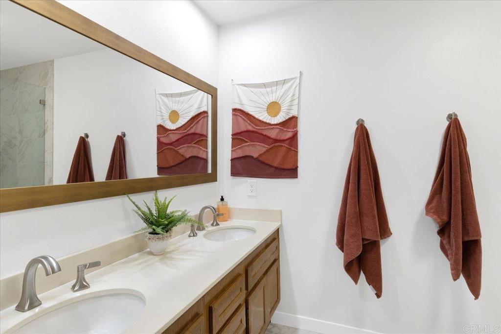 365 Windyridge Glen Escondido, CA 92026 - Photo 14 of 24 a bathroom with a sink and a mirror