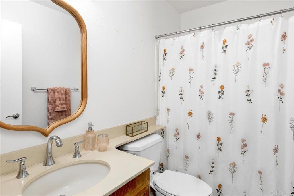 365 Windyridge Glen Escondido, CA 92026 - Photo 19 of 24 a bathroom with a sink and a mirror