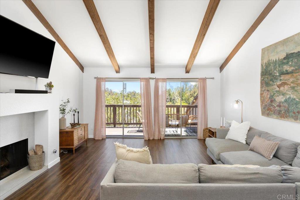 365 Windyridge Glen Escondido, CA 92026 - Photo 2 of 24 a living room with fireplace furniture and a flat screen tv