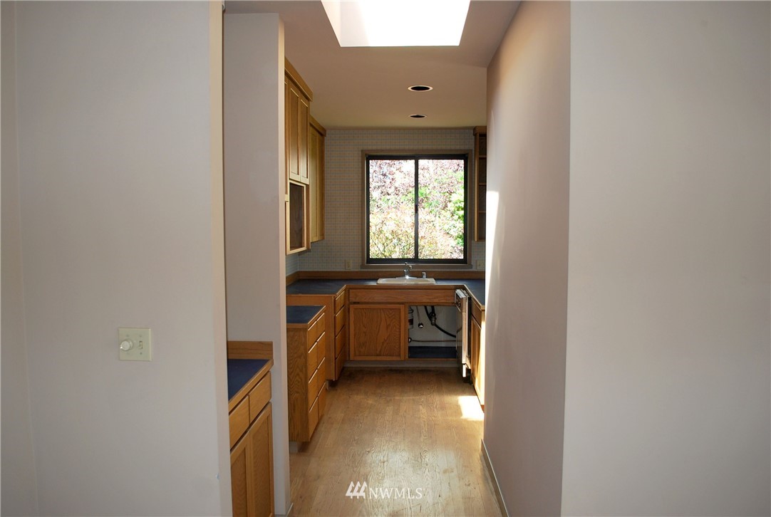 2021 1st Avenue, Unit 55 Seattle, WA 98121 - Photo 12 of 20 a view of utility room and bedroom
