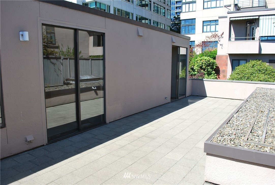 2021 1st Avenue, Unit 55 Seattle, WA 98121 - Photo 16 of 20 a view of a house with a outdoor space