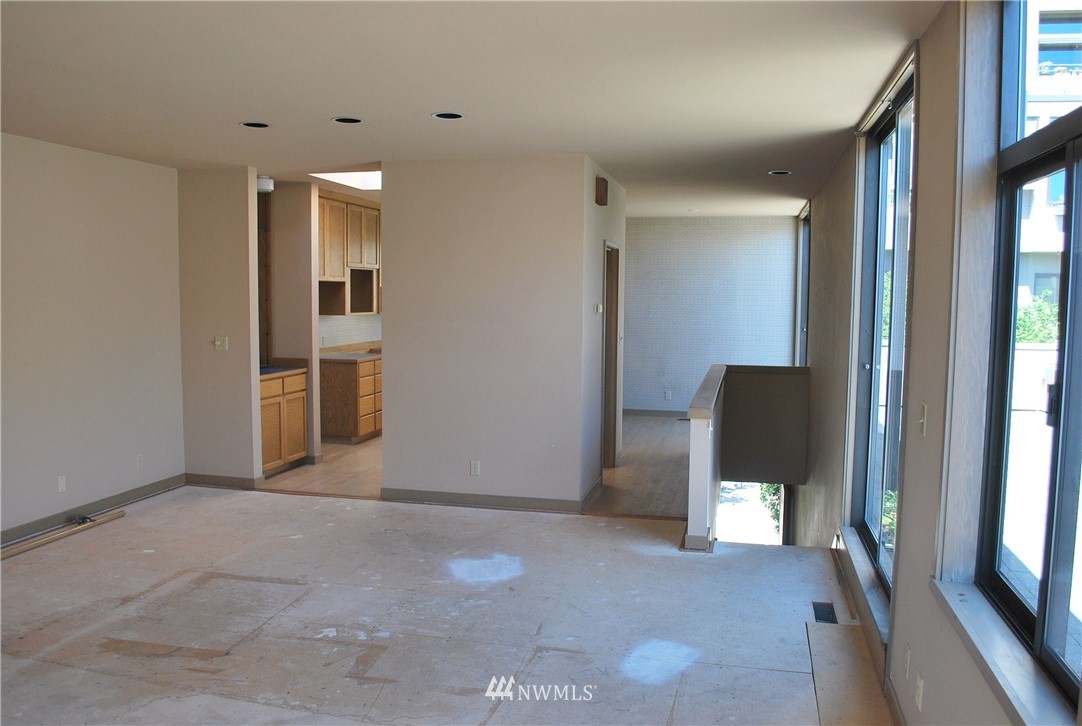 2021 1st Avenue, Unit 55 Seattle, WA 98121 - Photo 10 of 20 a view of livingroom with furniture and windows