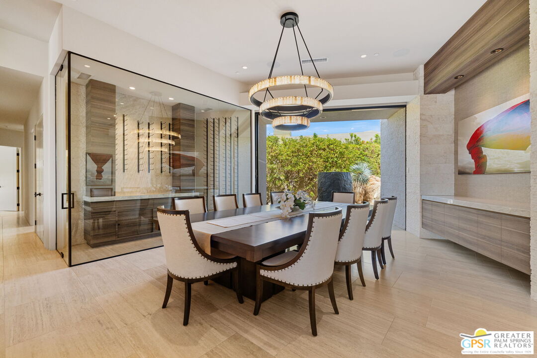 1 Sterling Ridge Drive Rancho Mirage, CA 92270 - Photo 16 of 51 a dining room with furniture a chandelier and wooden floor