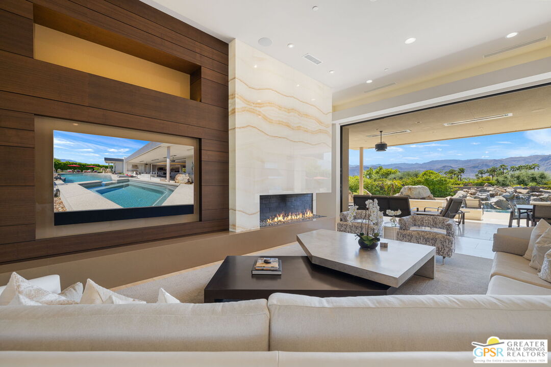 1 Sterling Ridge Drive Rancho Mirage, CA 92270 - Photo 21 of 51 a living room with furniture and a large window