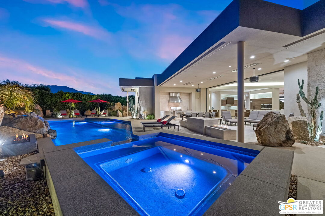 1 Sterling Ridge Drive Rancho Mirage, CA 92270 - Photo 25 of 51 a living room with lots of furniture and swimming pool