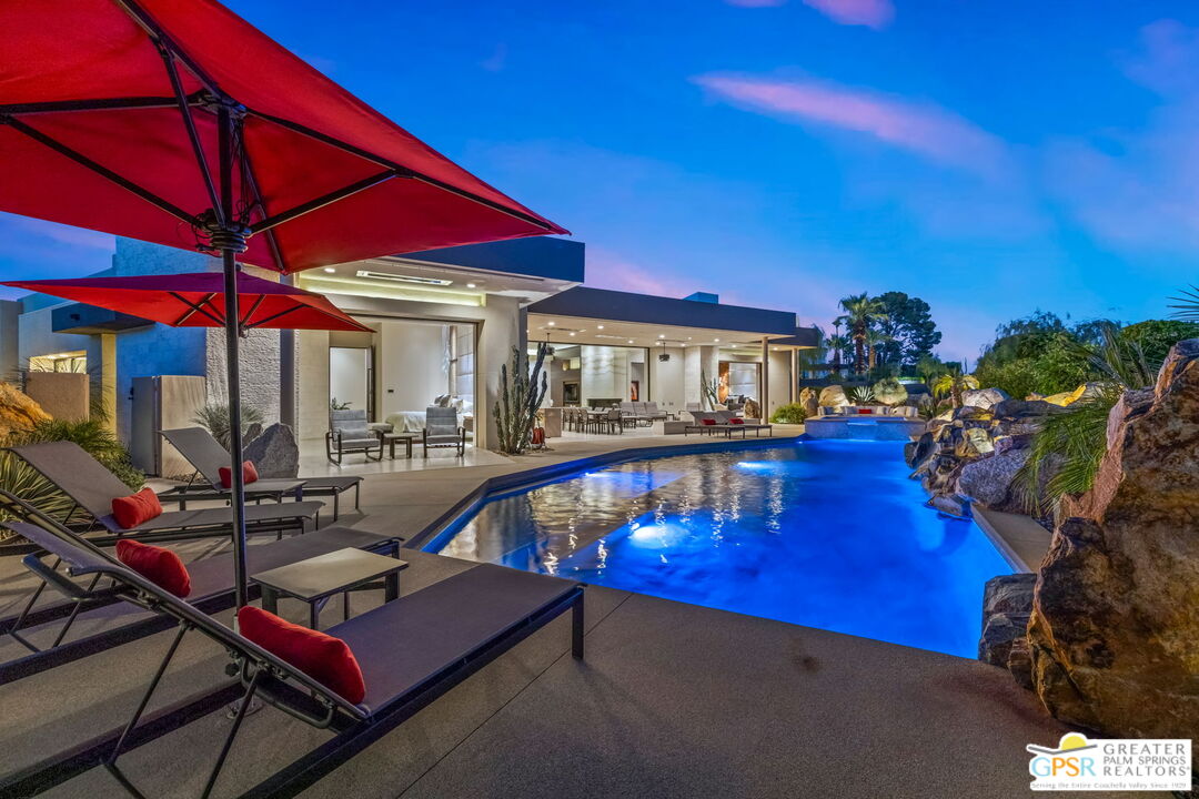 1 Sterling Ridge Drive Rancho Mirage, CA 92270 - Photo 28 of 51 a view of pool with lawn chairs under an umbrella