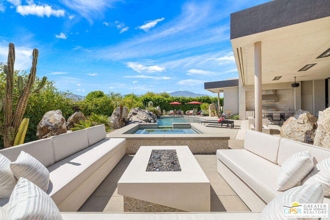 1 Sterling Ridge Drive Rancho Mirage, CA 92270 - Photo 3 of 51 a view of living room with patio furniture and a potted plants